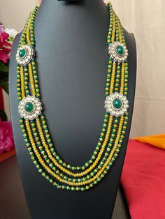 Green and Yellow color Beads 5 Lines Each side/22 inch Long Haram/Only One Haram/Kundan Stones/Side Pendents/Hand Made Haram/Indian jewelry. This item is perfect for Gift and  parties and festivals! DETAILS: Includes One Long Haram Only  Necklace: 22 inches Long total /Rope to go longer  Weighs 3.65 oz (103 g) Material: Kundan Antique Gold Finish. Finish: Premium Quality Antique Gold  finish.  NOTE: I try my best to show you photos of my products as they appear in real life, but please note that Traditional Green Beads For Jewelry Making, Kundan Necklace With Stone Work, Traditional Green Beads, Gems And Cabochons For Wedding, Polished Green Beads For Festivals, Traditional Green Jewelry With Faceted Beads, Green Beads For Jewelry Making And Festivals, Green Temple Necklace With Round Beads For Celebration, Festive Green Beads, Green Round Beads Mala For Wedding