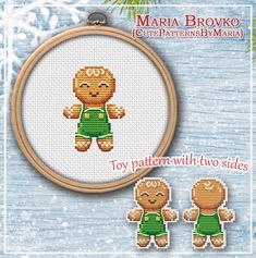 a cross stitch teddy bear with two sides in green shorts and t - shirt on it's chest