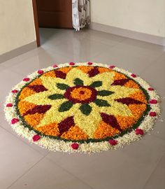 a large flower arrangement on the floor in a room