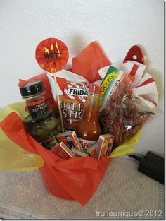 a gift basket filled with condiments and hot sauce