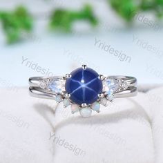 a blue ring with white stones on it