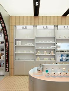 the inside of a cosmetics store with shelves and counter tops full of products on display