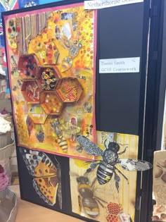 an art project with bees and honeycombs on display in a store or office