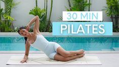 a woman is doing yoga in front of a swimming pool with the words 30 min pilates