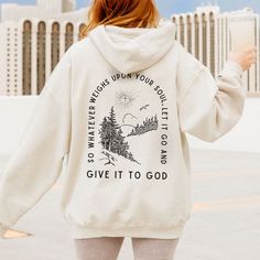 Get ready to be OBSESSED with this give it to god hoodie! It is the perfect gift for yourself or gift for a special someone to wear their faith! PRODUCT INFO -  50% cotton, 50% polyester blend fabric - Colors may vary based on your monitor or screen display SIZE INFORMATION - Relaxed  unisex fit - Please check the size guide our listing photos before ordering  your item - For a trendy oversized look, we recommend sizing up 1-2 sizes. ITEM CARE INSTRUCTIONS - Machine wash cold (max 30C or 90F) in Cute Christian Sweatshirt Designs, Inspirational Long Sleeve Relaxed Fit Hoodie, Inspirational Winter Hoodie With Graphic Print, Inspirational Graphic Print Hoodie For Winter, Christian Clothing Brand, Bible Shirts, Hoodie Allen, Christian Sweatshirt, Sweatshirt Designs