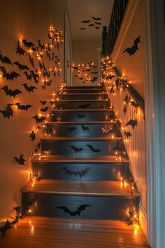 the stairs are decorated with bats and fairy lights