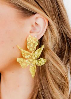 Add a pop of sunshine to your outfit with Zara Floral Earrings. These oversized, 80mm long earrings are perfect for making a statement. The bright yellow color and flower accents make for a quirky and fun addition to any outfit. Shine on! Flower Earring, Gold Confetti, Shine On, Floral Earrings, Sensitive Ears, Bright Yellow, Long Earrings, Flower Earrings, Yellow Color