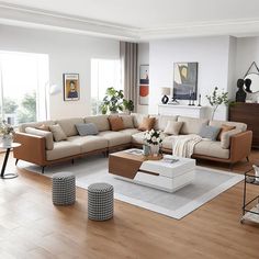 a living room filled with lots of furniture on top of a hard wood floored floor