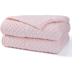 two pink blankets stacked on top of each other in front of a white background with polka dots