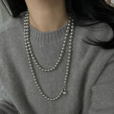 Elevate Your StyleExperience the epitome of versatility and elegance with our Gray Glare Pearl Multi-Way Necklace. This gold-plated beauty features Swarovski pearls that exude a mesmerizing charm, perfect for enhancing any ensemble. Whether draped as a luxurious long necklace or layered for a chic double-strand look, this necklace effortlessly elevates your style game. Pearl White Long Pearl Necklace In Elegant Style, Elegant Pearl White Long Necklace, Elegant Pearl White Long Pearl Necklace, Elegant Pearl Long Necklace As Gift, Elegant Pearl Long Necklace For Gift, Long Pearl Chain Necklace, Silver Long Necklace With Pearl Chain, Elegant Long Necklace With Pearl Pendant As Gift, Elegant Long Silver Pearl Necklace