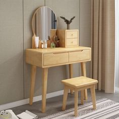 a wooden dressing table and stool with a mirror on the wall next to it in front of a window