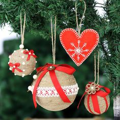 three christmas ornaments hanging from a tree