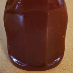 a jar filled with liquid sitting on top of a counter