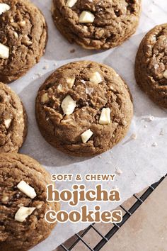 soft and chewy hojcha cookies with white chocolate chips on top are sitting on a cooling rack