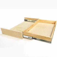 two wooden drawers with metal handles on each side and one open drawer at the bottom