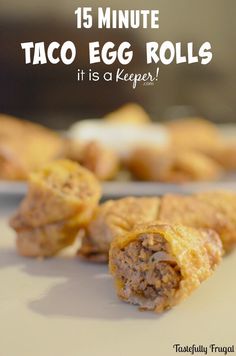 some taco egg rolls on a plate with text overlay that reads 15 minute taco egg rolls it is a keeper