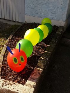 an inflatable caterpillar sitting on the ground