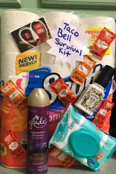 an assortment of toiletries and personal care items on a counter top with a sign in the background