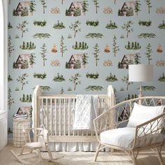 a baby's room with a rocking chair and wallpaper