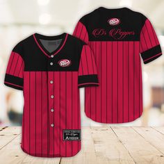 Sleek Black Vertical Striped Dr Pepper Baseball Jersey, dr pepper shirt, dr pepper jersey, diet dr pepper shirt, dr pepper free shirt, vintage dr pepper shirt, dr pepper shirt womens. Red Casual Short Sleeve Jersey, Red Retro Top For Game Day, Retro Red Top For Game Day, Red Cotton Short Sleeve Baseball Jersey, Game Day Cotton Jersey With Short Sleeves, Casual Cotton Jersey For Game Day, Fitted Short Sleeve Baseball Jersey For College, Fitted Tops For Baseball Season And Sports Events, Casual Fitted Baseball Jersey With Crew Neck