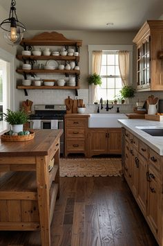 a kitchen filled with wooden cabinets and lots of counter top space next to a window