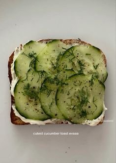 cucumber toast with cream cheese and dill on white bread, top view