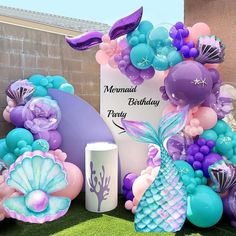 a mermaid themed birthday party with balloons and decorations