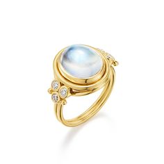 This is the first ring Temple ever made. It finds our signature stone, the Blue Moonstone, in one of our most iconic settings. Flanked by two trios of expertly cut diamonds, The 18K Classic Temple Ring is the ultimate addition to any jewelry collection. Product Details  18K gold Blue Moonstone (6cts) Diamond (0.3cts) W St Claire, Traditional Diamond, Mini Earrings, Moonstone Engagement Ring, Gold Cocktail Ring, Bezel Ring, Blue Moonstone, Gemstone Engagement, Unique Gemstones