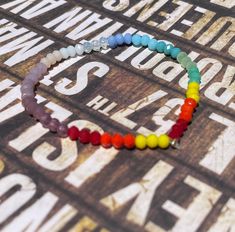 This gorgeous bracelet is a reminder to embrace the rainbows, the little miracles. It's on elastic, nickel free and crimped. Match it with our My Life in Technicolor Ombre Rainbow Crystal Necklace: https://www.etsy.com/listing/1250257337/my-life-in-technicolor-ombre-rainbow?click_key=5c32b651b340ea2bac9e96aec784170f98e67d91%3A1250257337&click_sum=b729c3cd&ref=shop_home_active_10&pro=1&sts=1 One size fits most. Please contact me for any sizing inquiries so that I can best accomdate you. Rainbow Crystal Bracelet, Bear Necklace, Rainbow Crystal, Gummy Bears, Gorgeous Bracelet, Candy Corn, Crystal Bracelets, How To Make Beads, Cute Cards