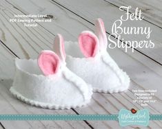 a pair of white slippers with pink bunny ears on the front and back side