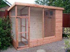 a chicken coop in the middle of a yard