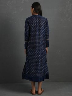 A free-size flowy Indigo chanderi kurta with gold block print, gota detail and pleated hem. Garment measurements (in Inches): Free size: Length - 47", Bust - 61", Waist - 60" Fabric: Chanderi (Cotton silk) Color: Indigo Fit: Model height - 5"7" Fit - Loose/comfortable Technique: Hand block printed in gold with gotta details Instructions: Dry clean only Note: Available in other colors This product will be shipped within 20-25 days of the order placed Best Deal, Cotton Silk, Model Height, Block Print, Free Size, High Neck Dress, Hand Weaving, Dry Clean, Long Sleeve Dress