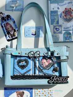 a blue handbag with pictures on it