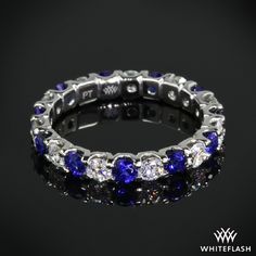 a white gold ring with blue sapphires and diamonds on the inside, set in 18k white gold