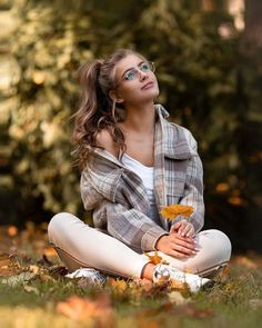 a woman sitting on the ground with her eyes closed