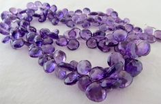 a purple necklace with lots of amethorate beads