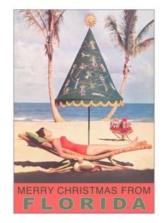 a vintage florida christmas card with a woman laying on the beach under an umbrella