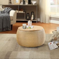 a living room filled with furniture and a coffee table on top of a carpeted floor