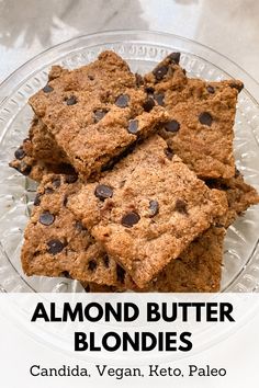 almond butter blondies on a glass plate with text overlay that reads, almond butter blondies