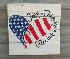 a wooden sign with the words faith, dance, and freedom painted on it's side