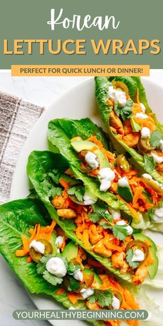 lettuce wraps with carrots and cheese on top, sitting on a white plate