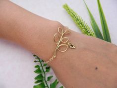 GOLD Leaf Initial Bracelet, ADJUSTABLE, Monogram Bracelet, Bridesmaid Gifts, Personalized, Flower Girl,Mothers, Junior Bridesmaid Jewelry Lovely bracelet of delicate gold plated leaf branch with personalized initial leaf charm. This bracelet 7 1/2 inch of gold filled chain with clasp and wire wrapped pearl on other end of the clasp. Bracelet can be made 5-9 inch **Please leave you Initial and desired length when Checkout Add more Initial http://www.etsy.com/listing/81745217 **Bride!! If you need Gold Flower Charm Bracelet Adjustable, Gold Flower Charm Bracelet With Adjustable Fit, Gold Bracelets For Mother's Day Party, Gold Bracelets For Party On Mother's Day, Gold Flower Charm Bracelet As Gift, Adjustable Gold Jewelry For Bridesmaid, Gold Flower Charm Bracelet For Gift, Personalized Gold Charm Bracelet For Bridesmaid Gift, Elegant Gold Bridesmaid Bracelets