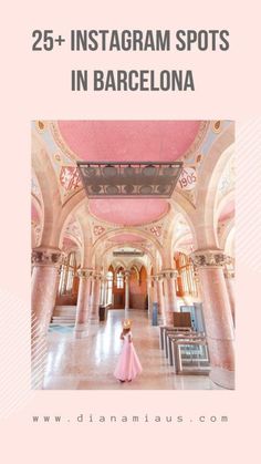 a woman in a pink dress is standing in the middle of an ornate building with columns and