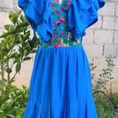 Beautiful Floral embroidered Mexican dresses , handmade in Chiapas, México.  Perfect for your bridesmaid, different embroidered colors.   We have sizes S to XXL Colors: blue, black, pink,beige, red Please send me a message with the color and size are you looking for.    Our products are hand-crafted using traditional techniques, maintaining their local artisanal skills. Minimal variations of color and design may exist in handmade pieces. Blue Ruffled Dresses For Festival, Traditional Blue Ruffled Dress, Traditional Blue Dress With Ruffles, Bohemian Ruffle Dress For Fiesta, Bohemian Ruffled Dress For Fiesta, Bohemian Embroidered Fiesta Dresses, Bohemian Maxi Dress For Fiesta, Traditional Blue Fiesta Dress, Bohemian Embroidered Dress For Cinco De Mayo Fiesta