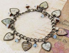 a close up of a bracelet with charms on it