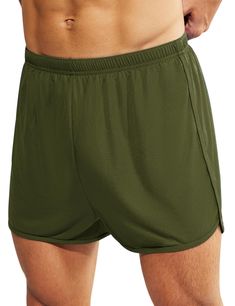 a man with his shirt off and no shirt on, wearing green boxershorts