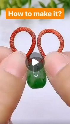 someone is holding two red and green rings in their hands with the words how to make it?