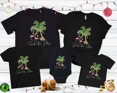 Deck the Palms Beach Christmas family shirts. These coastal Christmas matching tshirts are a great option for matching family tops. Get your family shirts for Mom, Dad, baby, kid, and toddlers. Merry Beachmas! 🎄 Shirt color is black 🎄 100% soft cotton 🎄 Unisex sizing 🎄 See the sizing chart photos for specific measurements CARE INSTRUCTIONS Machine wash: cold; Do not bleach; Tumble dry: low heat; Iron, steam or dry: low heat; Do not dry clean. For baby bodysuit: Non-chlorine: bleach as needed. Deck The Palms, Palm Tree Decorations, Hawaii Christmas, Christmas Vacation Shirts, Matching Tshirts, Mom Dad Baby, Florida Christmas, Beach Tanks Tops, Tropical Holiday