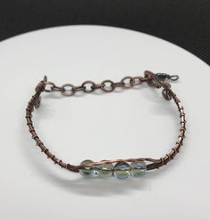 a close up of a bracelet on a plate