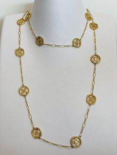 This striking 18k gold necklace was crafted by world renowned jewelry designer John Hardy and is a part of their Batu Kawung collection. The term 'Batu' means firm/stable while 'Kawung' is a very old Indonesian motif featuring four lobed leaf petals forming a blossom which symbolizes fertility and hope. This stunning necklace was made in 18K yellow gold and weighs 29.77 grams. It is a 36 inch necklace and is in excellent condition. This special piece has been authenticated by renowned independen Feminine Wardrobe, Glendale Az, Dragon Ring, 18k Gold Necklace, Pearl And Diamond Ring, John Hardy, Heart Locket, Ring Photos, Stunning Necklace